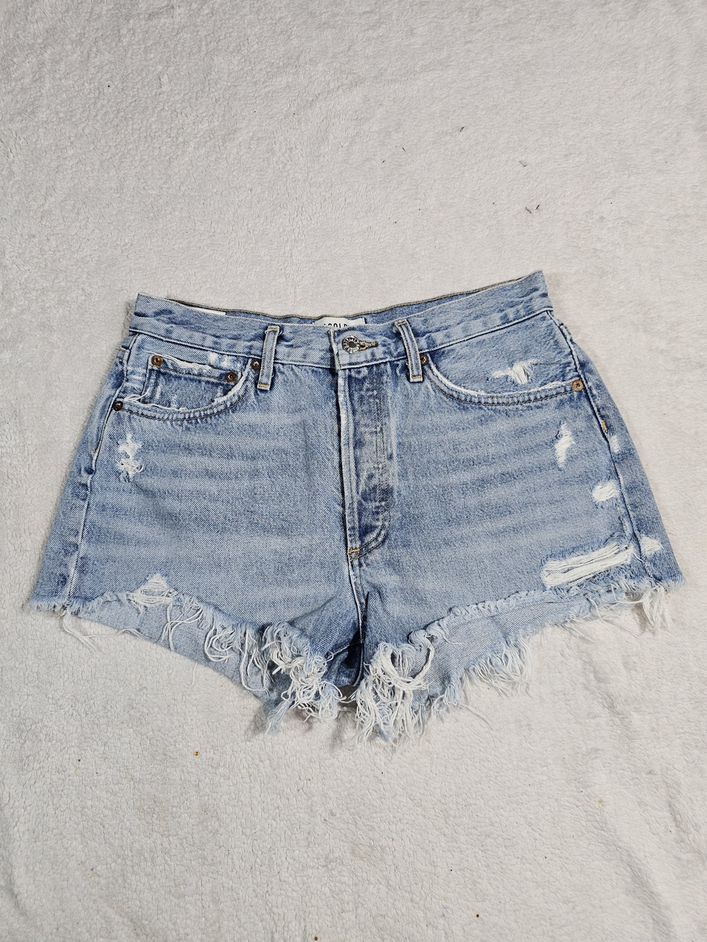 Agolde Light Blue Distressed High-Rise Denim Shorts.